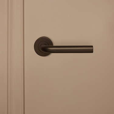 Oristano deurklink brons met rond rozet